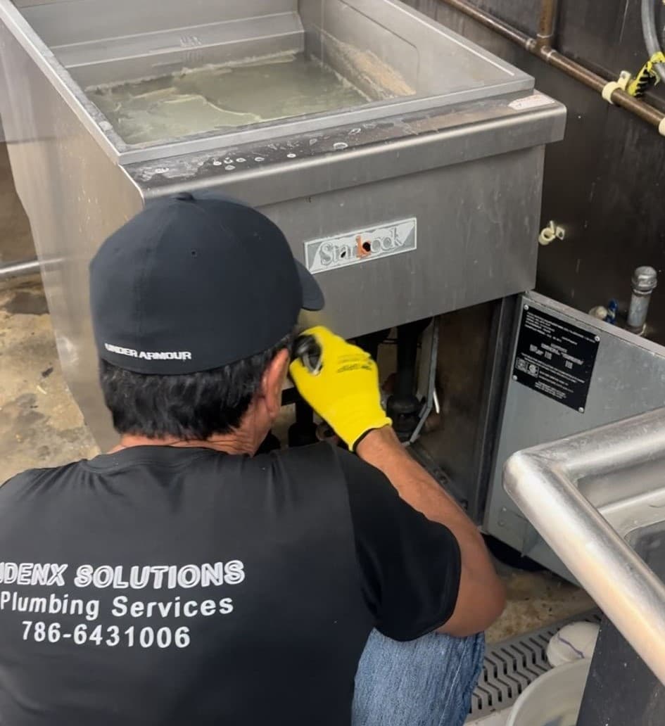 Plumber in Coral Gables working on a project